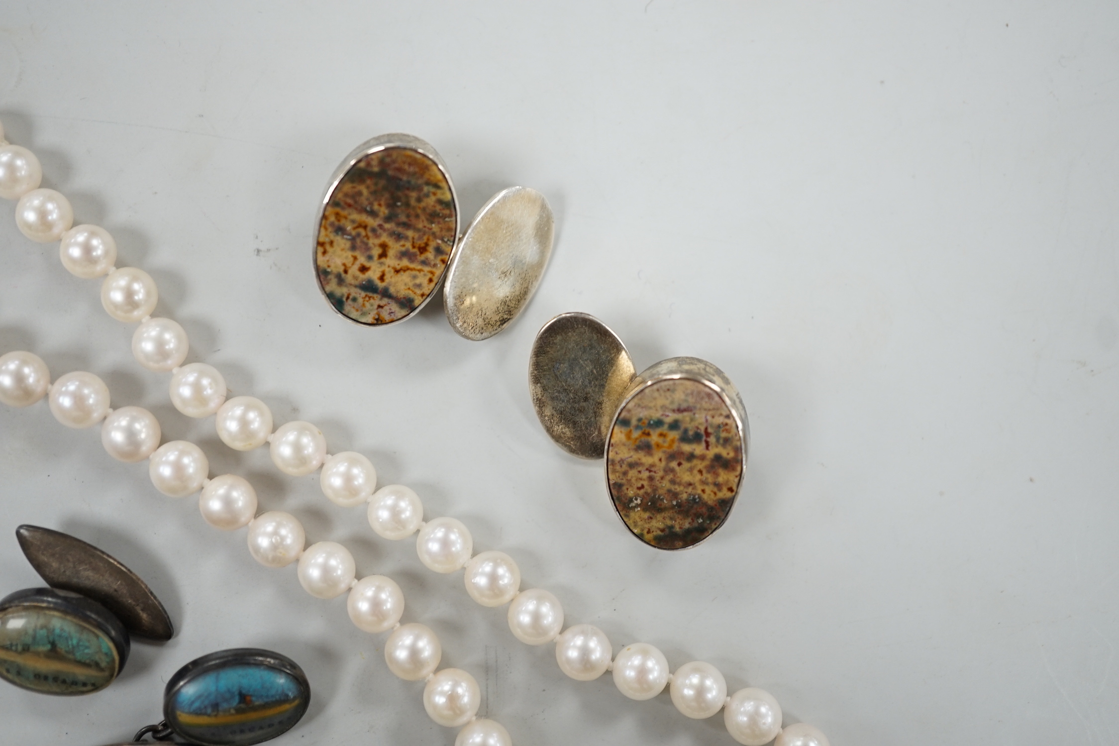 A modern pair of silver and hardstone set oval cufflinks, one other pair decorated with the 'S.S. Orcades' and a cultured pearl necklace.